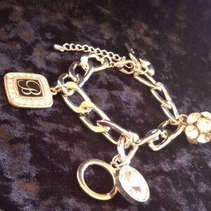 Elegant Gold and Silver Charm Bracelet